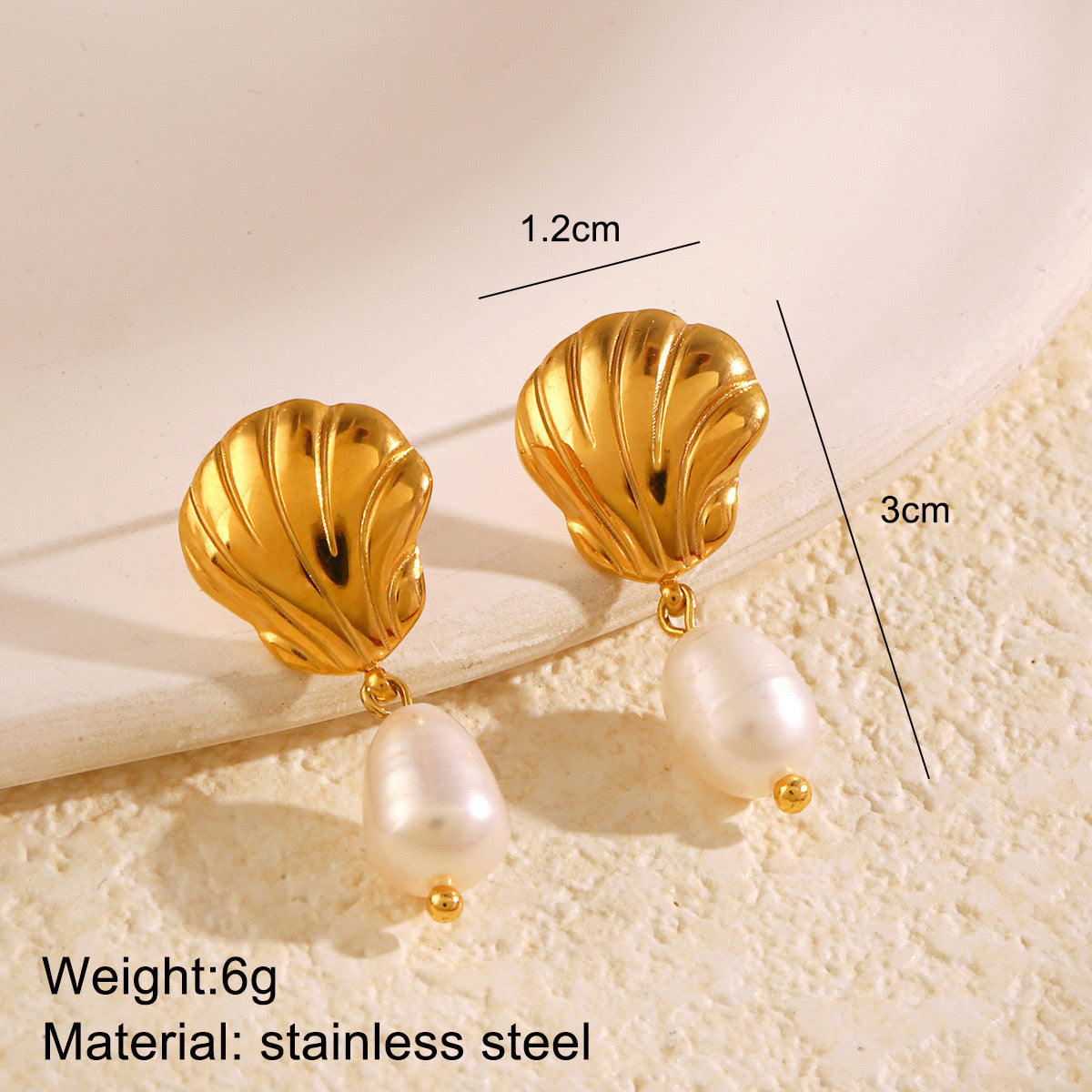 Shell with a pearl dangler