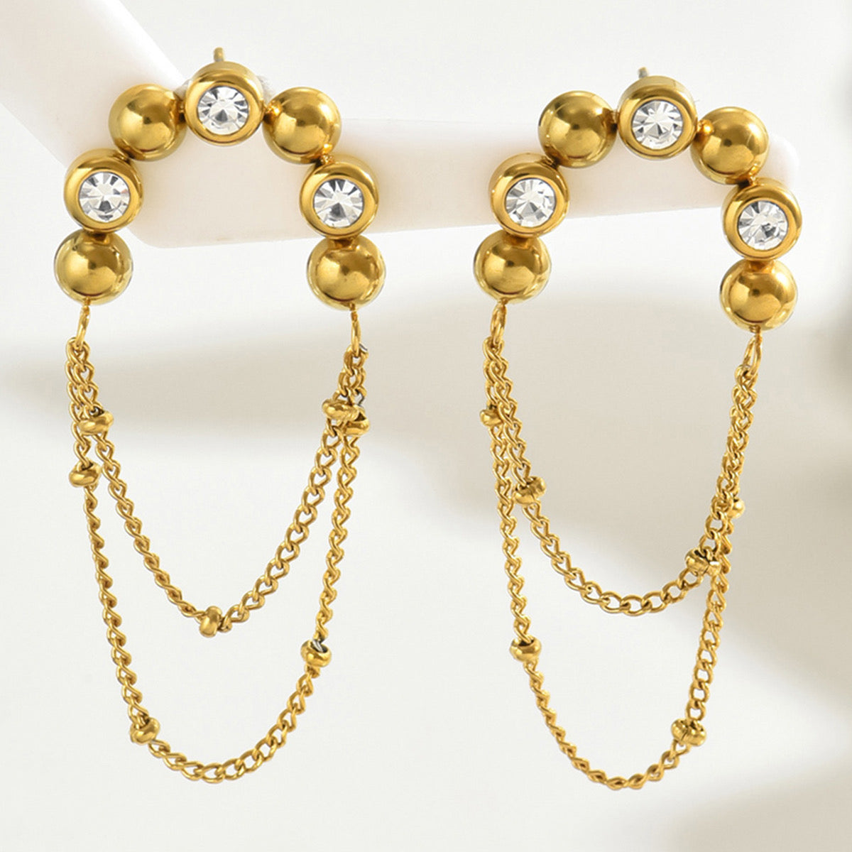 Half circle with dangling chain
