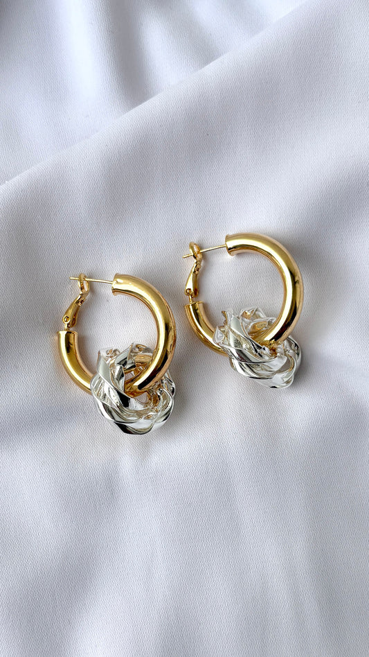 Silver flower in golden hoop