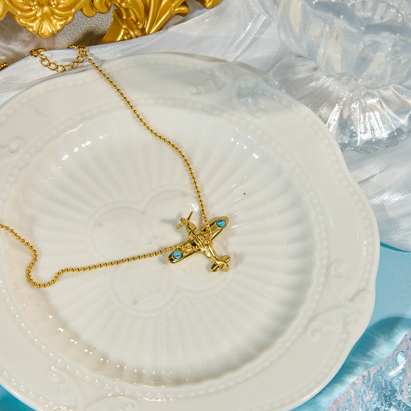 Aeroplane in a dainty neckchain